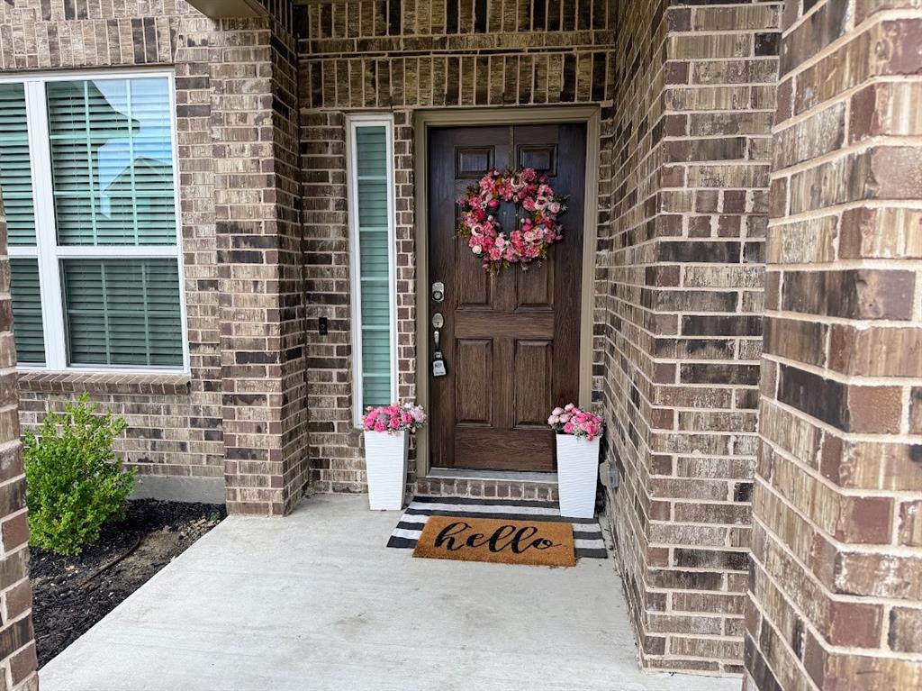 1109 Pinnacle Ridge Road Fort Worth, TX 76052 - Photo 3 of 40 a front view of a building with an outdoor space