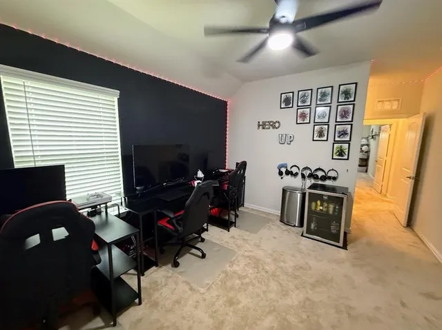 a view of a livingroom with furniture and a flat screen tv