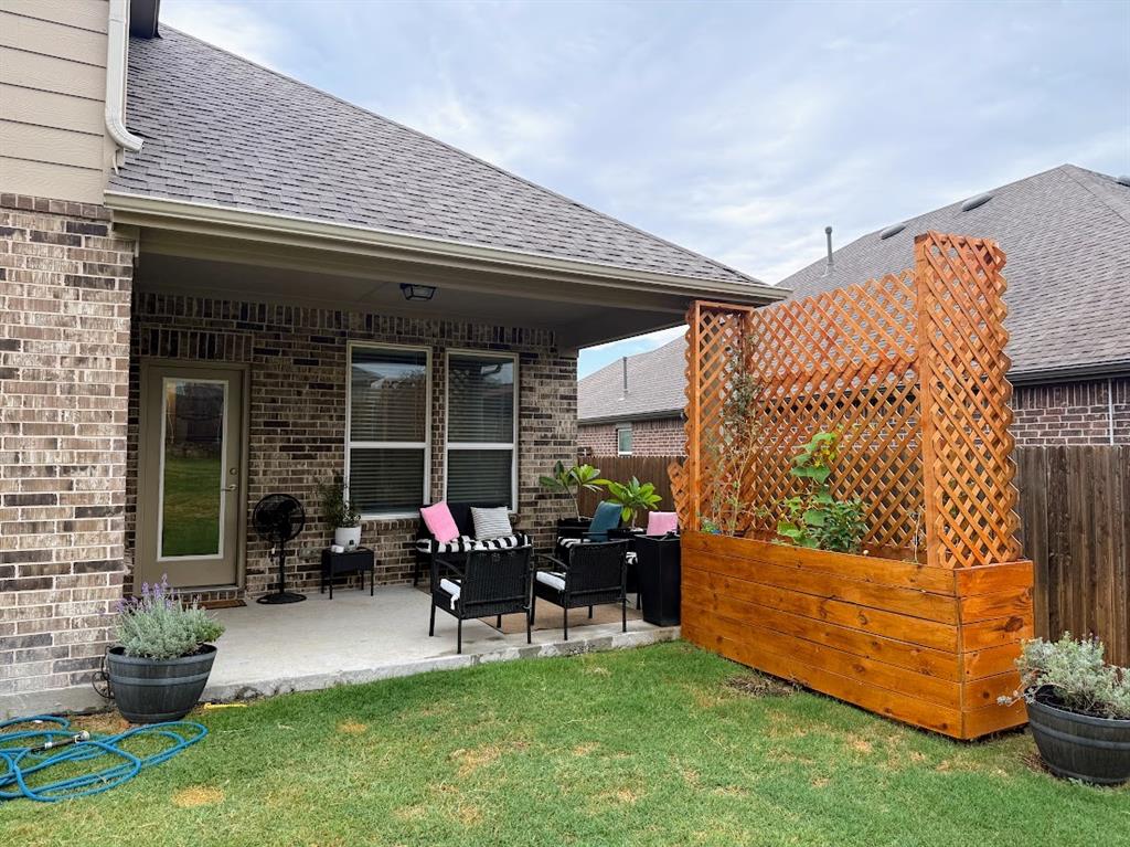1109 Pinnacle Ridge Road Fort Worth, TX 76052 - Photo 38 of 40 a house view with sitting space and garden