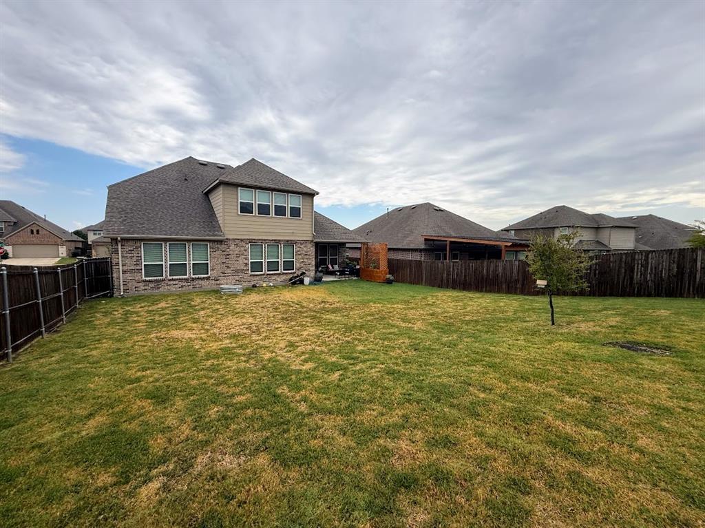 1109 Pinnacle Ridge Road Fort Worth, TX 76052 - Photo 39 of 40 a front view of a house with a yard