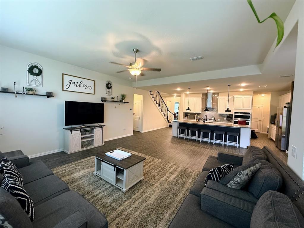 1109 Pinnacle Ridge Road Fort Worth, TX 76052 - Photo 7 of 40 a living room with furniture and a flat screen tv
