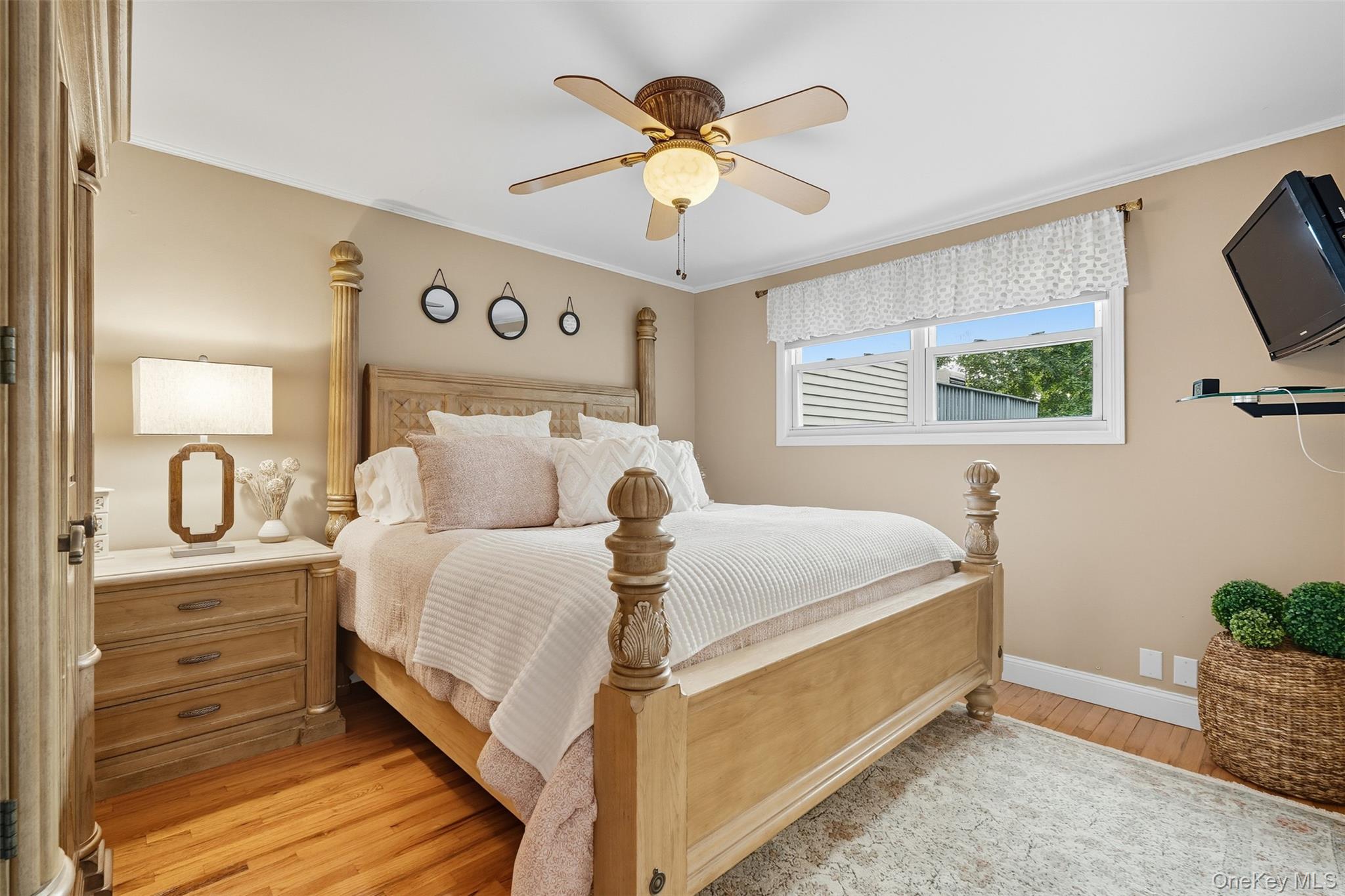 2747 Larkspur Street Yorktown Heights, NY 10598 - Photo 14 of 32 a bed room with a bed and a flat screen tv