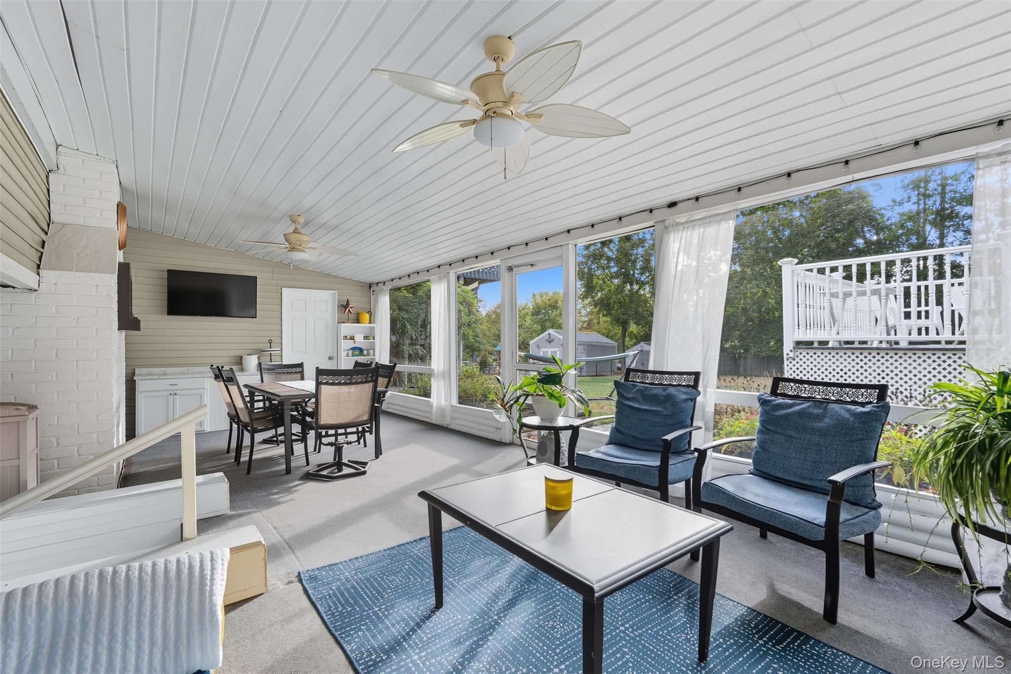 2747 Larkspur Street Yorktown Heights, NY 10598 - Photo 18 of 32 a living room with furniture and a large window