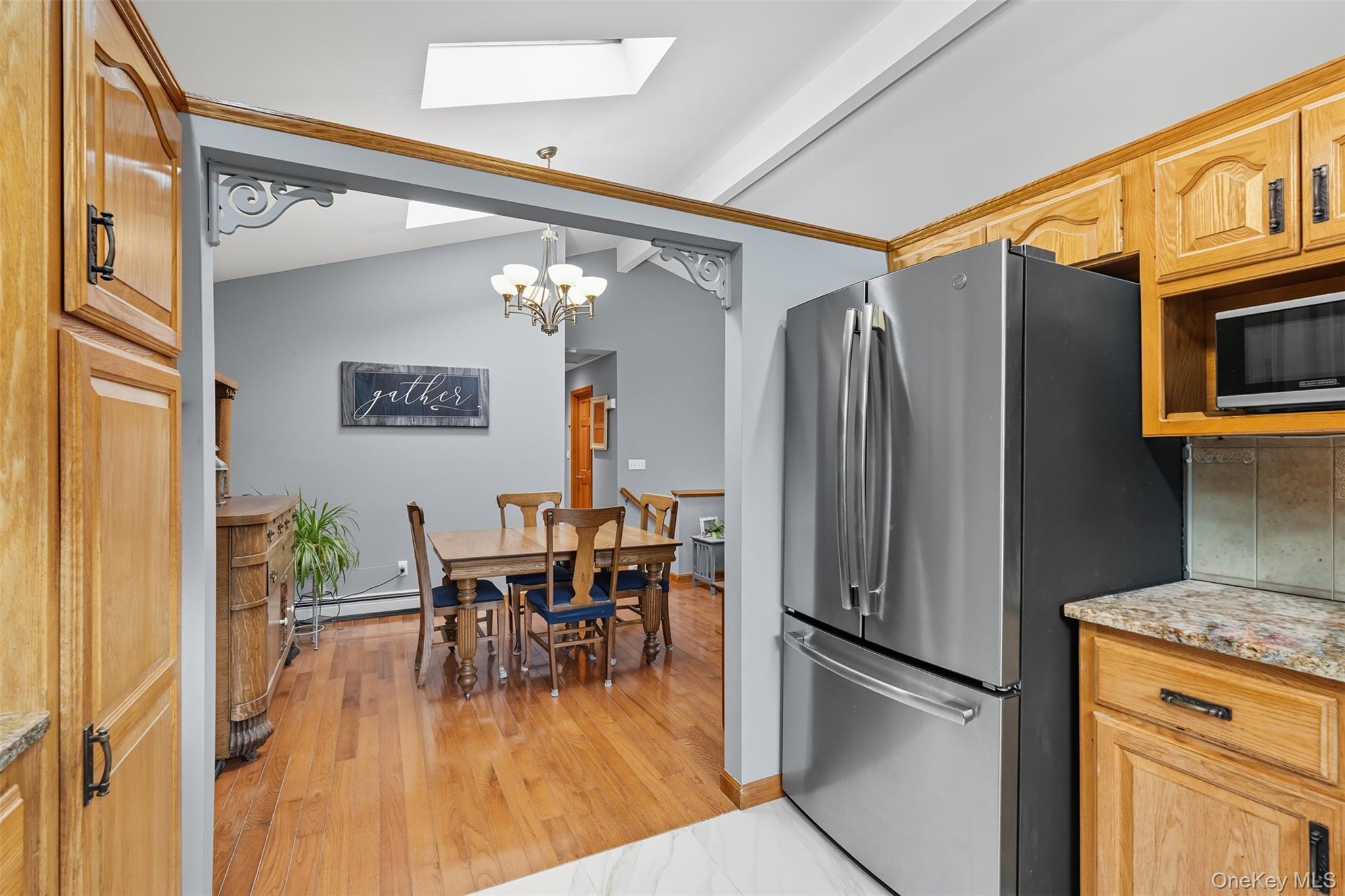 2747 Larkspur Street Yorktown Heights, NY 10598 - Photo 22 of 32 a kitchen with stainless steel appliances granite countertop a refrigerator and a stove top oven