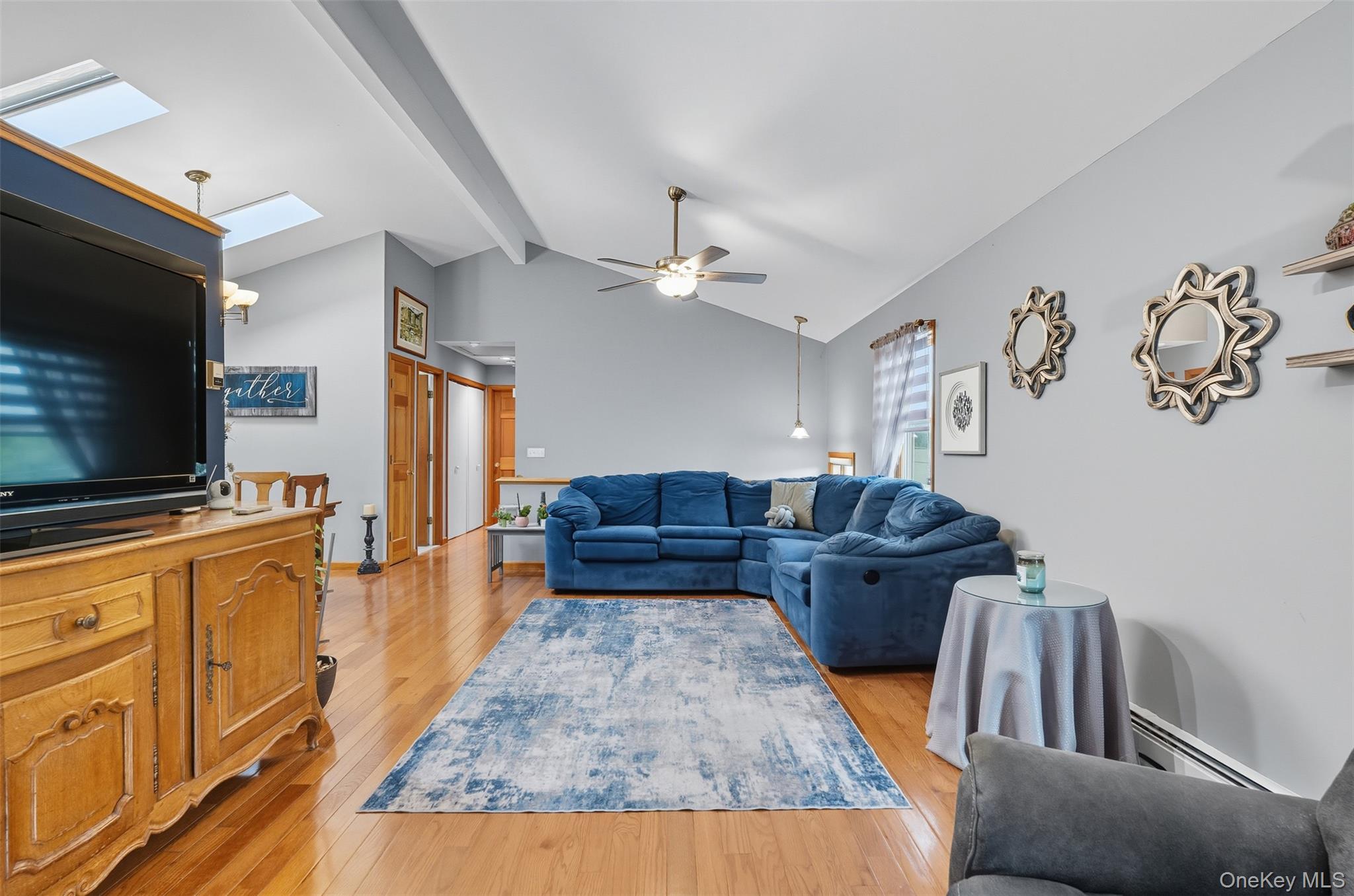 2747 Larkspur Street Yorktown Heights, NY 10598 - Photo 24 of 32 a living room with furniture and a flat screen tv