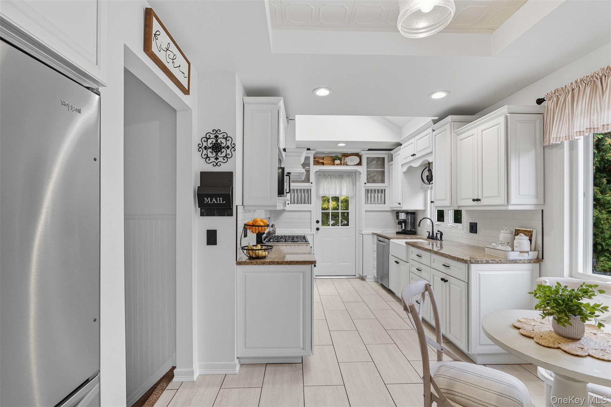 2747 Larkspur Street Yorktown Heights, NY 10598 - Photo 3 of 32 a kitchen with cabinets and appliances