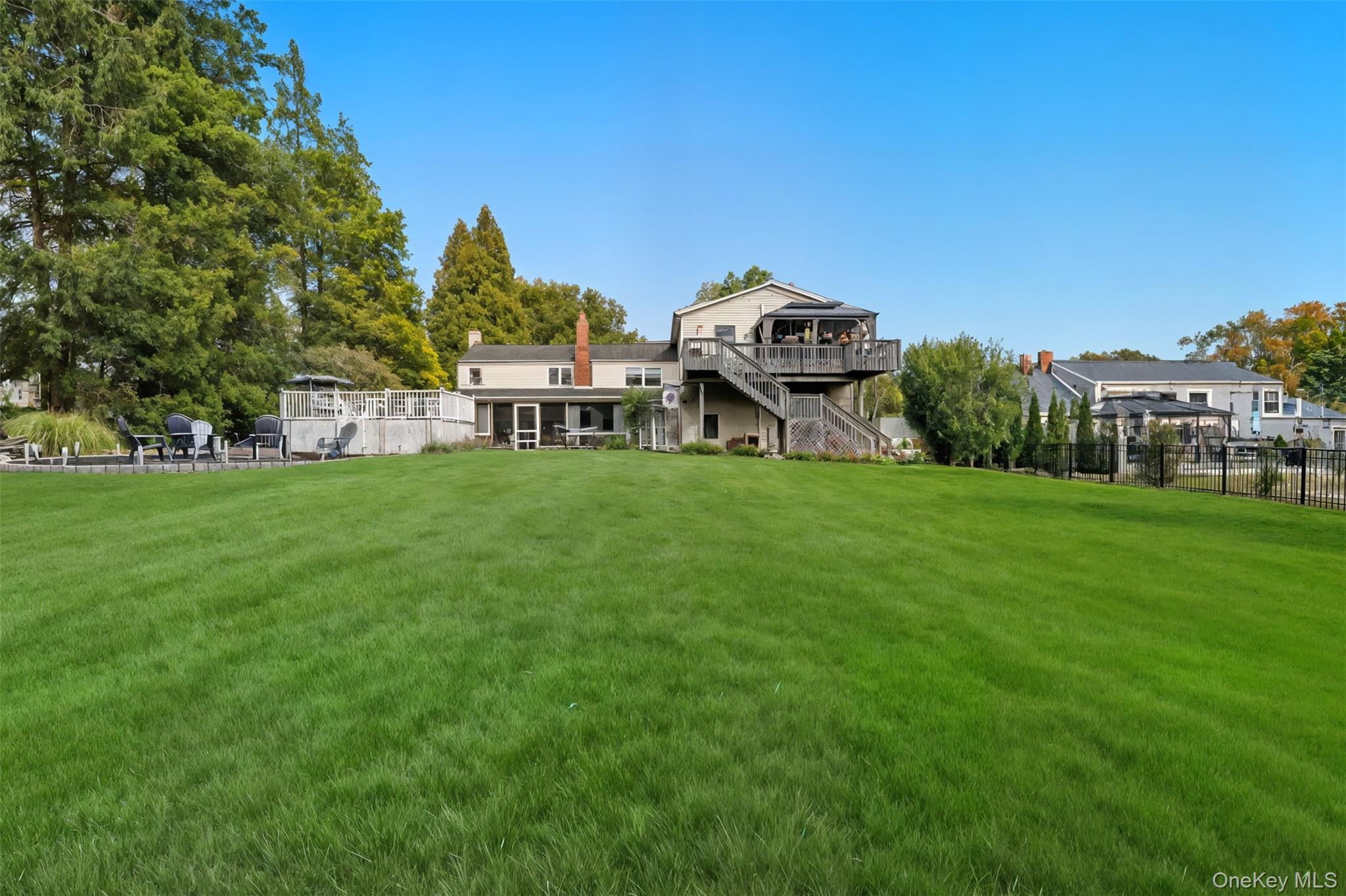 2747 Larkspur Street Yorktown Heights, NY 10598 - Photo 31 of 32 a view of a house with a yard and sitting area