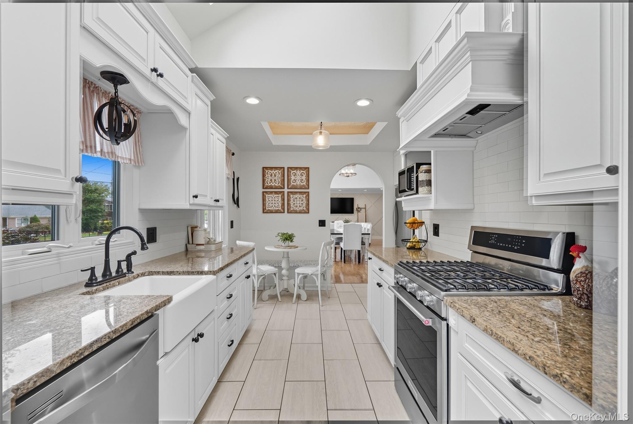 2747 Larkspur Street Yorktown Heights, NY 10598 - Photo 4 of 32 a kitchen with stainless steel appliances granite countertop a sink stove and cabinets
