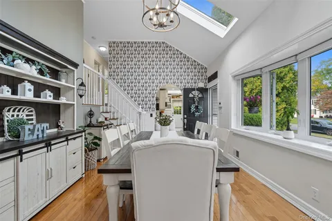 a very nice looking room with a large window and kitchen view