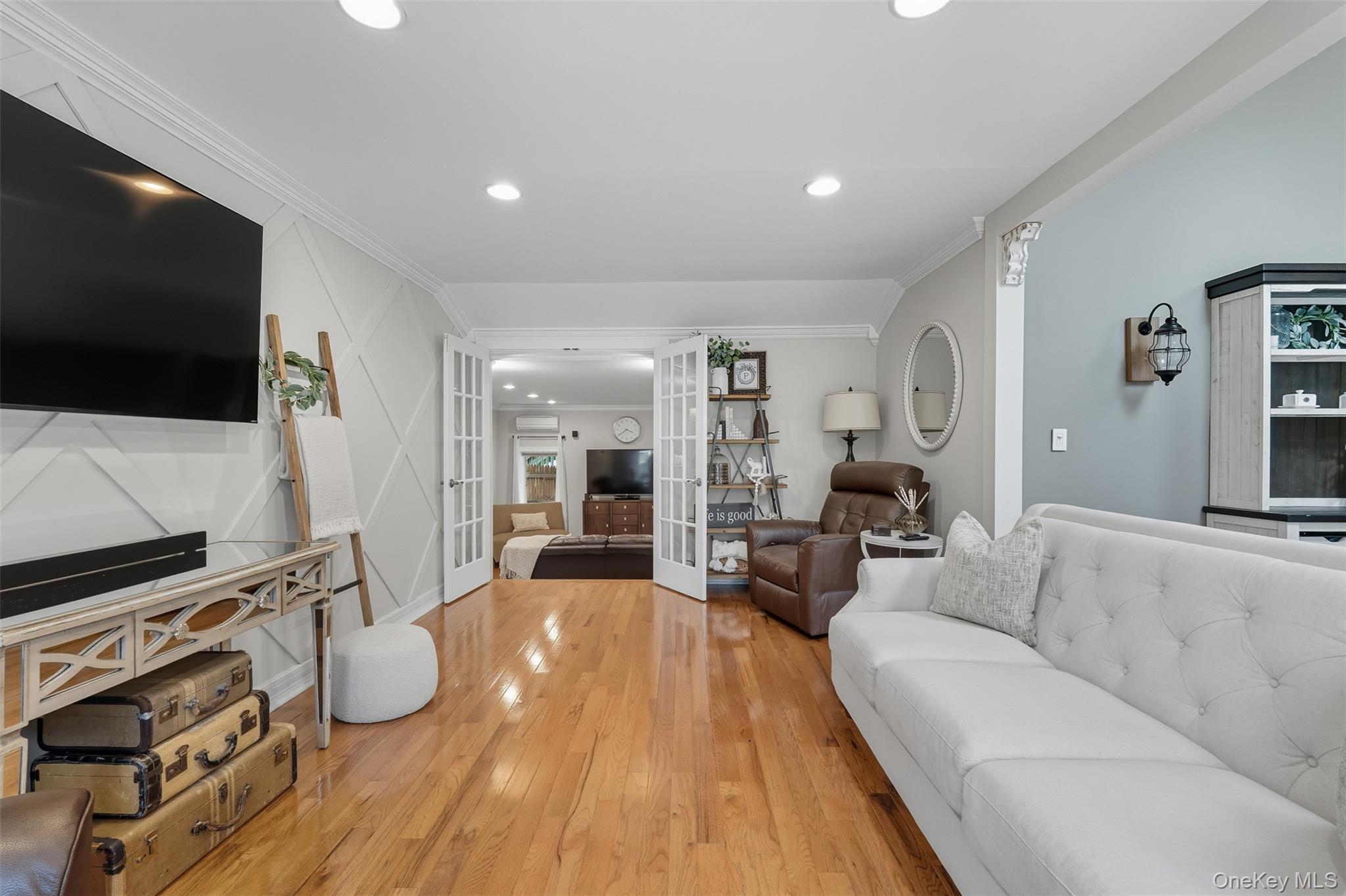 2747 Larkspur Street Yorktown Heights, NY 10598 - Photo 9 of 32 a living room with furniture and a flat screen tv
