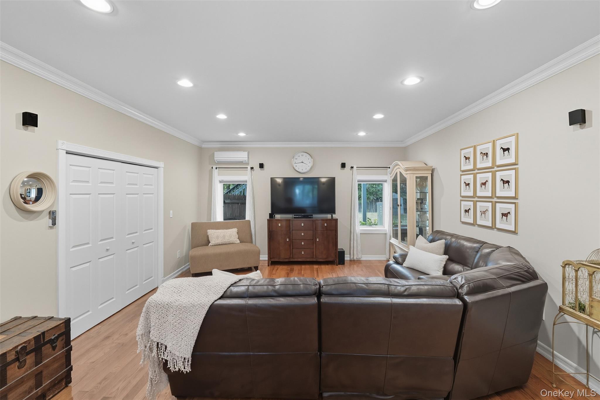 2747 Larkspur Street Yorktown Heights, NY 10598 - Photo 10 of 32 a living room with a couch and a flat screen tv