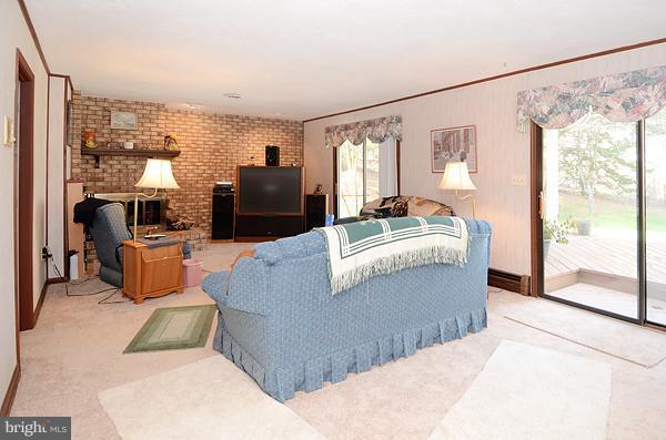 1202 Peachtree Road Fallston, MD 21047 - Photo 12 of 30 a living room with furniture and a floor to ceiling window