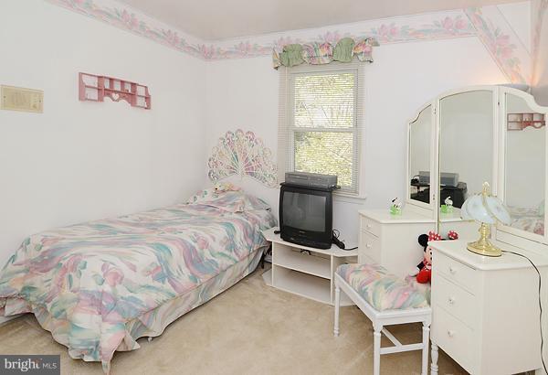 1202 Peachtree Road Fallston, MD 21047 - Photo 19 of 30 a bedroom with a bed and a table in it