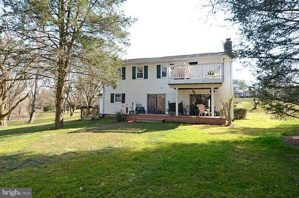 1202 Peachtree Road Fallston, MD 21047 - Photo 20 of 30 a view of a house with a big yard and large trees