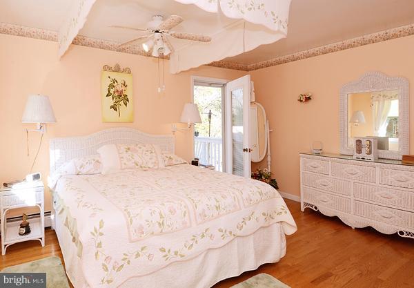 1202 Peachtree Road Fallston, MD 21047 - Photo 21 of 30 a spacious bedroom with a bed and a chandelier