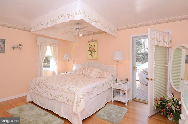 1202 Peachtree Road Fallston, MD 21047 - Photo 22 of 30 a bedroom with a large bed and a chandelier