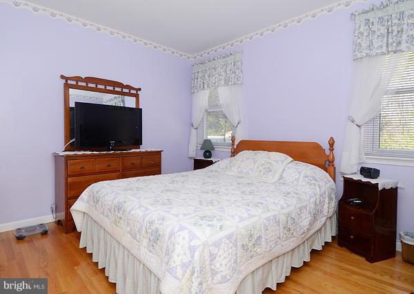 1202 Peachtree Road Fallston, MD 21047 - Photo 9 of 30 a bedroom with a bed and a flat screen tv