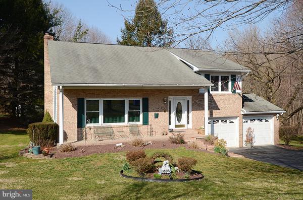1202 Peachtree Road Fallston, MD 21047 - Photo 10 of 30 a front view of a house with a yard garage and outdoor seating