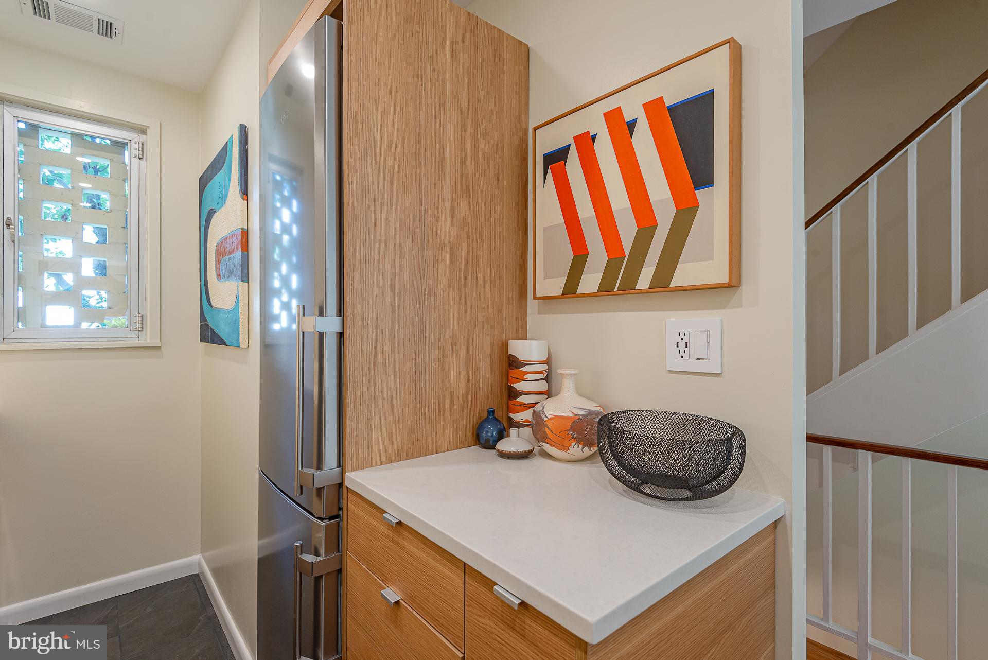 213 G Street Southwest, Unit 132 Washington, DC 20024 - Photo 10 of 27 Silestone quartz countertop and slate floors
