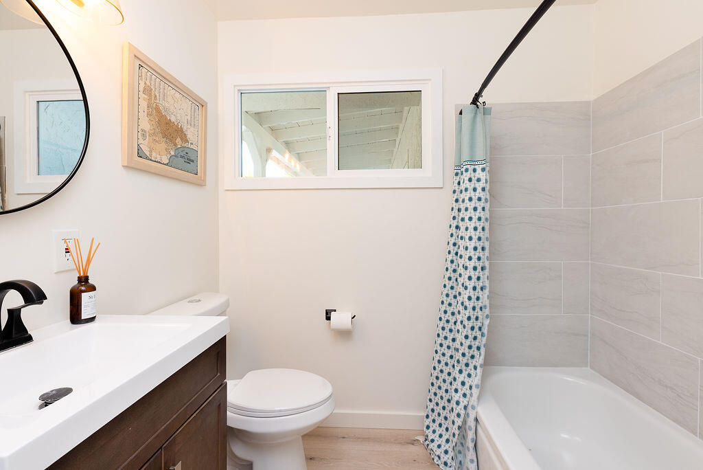 1430 Linhere Drive Carpinteria, CA 93013 - Photo 15 of 34 a bathroom with a sink a toilet and shower