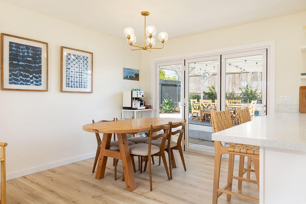 1430 Linhere Drive Carpinteria, CA 93013 - Photo 9 of 34 a view of a dining room with furniture wooden floor and chandelier