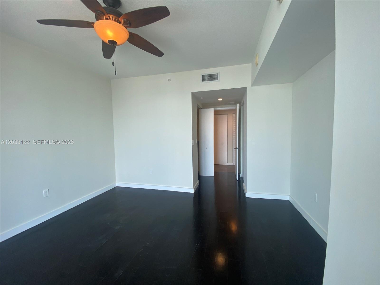 185 Southwest 7th Street, Unit 4206 Miami, FL 33130 - Photo 13 of 26 a view of an empty room with a fan