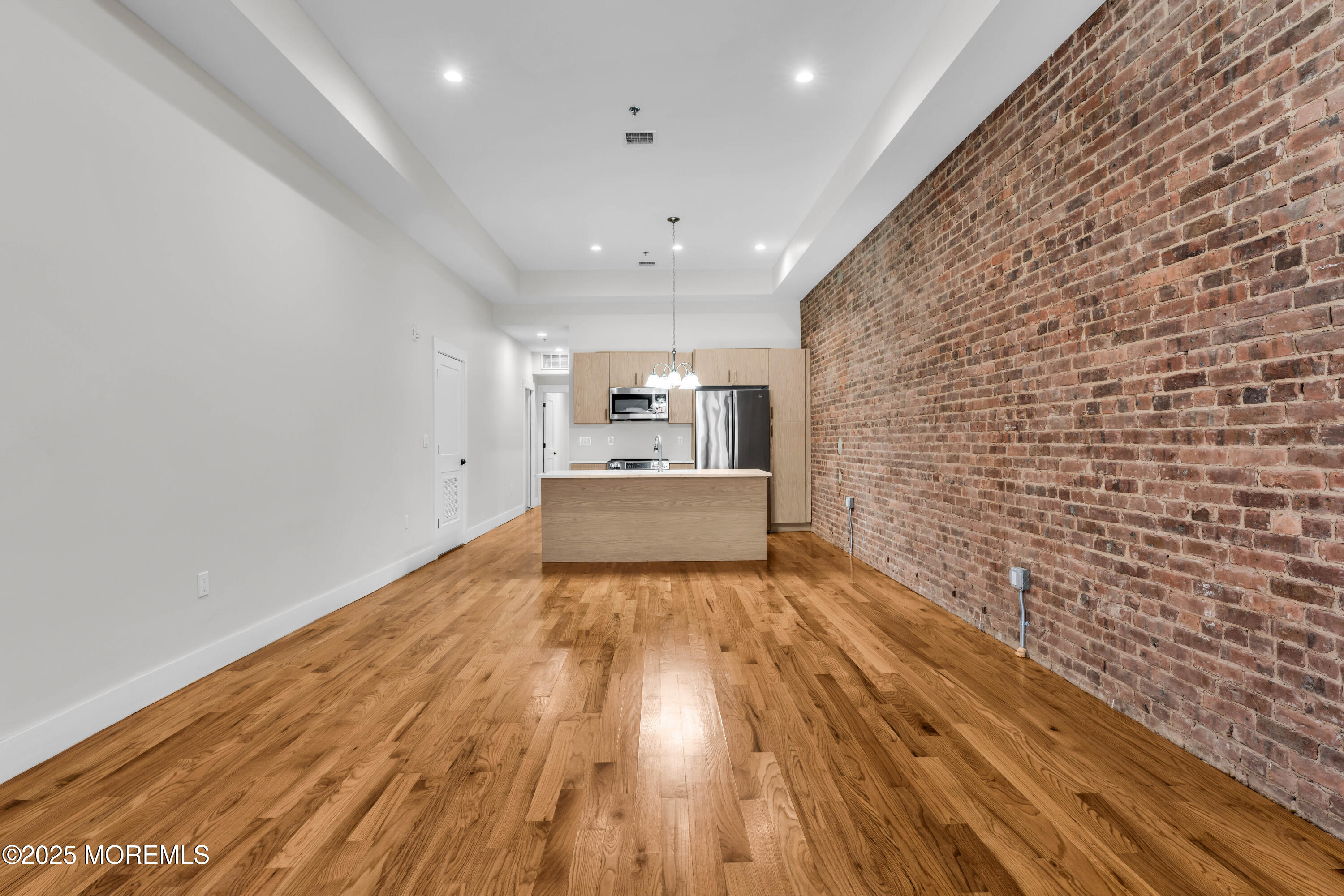 7 Broad Street, Unit 2 Red Bank, NJ 07701 - Photo 3 of 23 a view of empty room with wooden floor