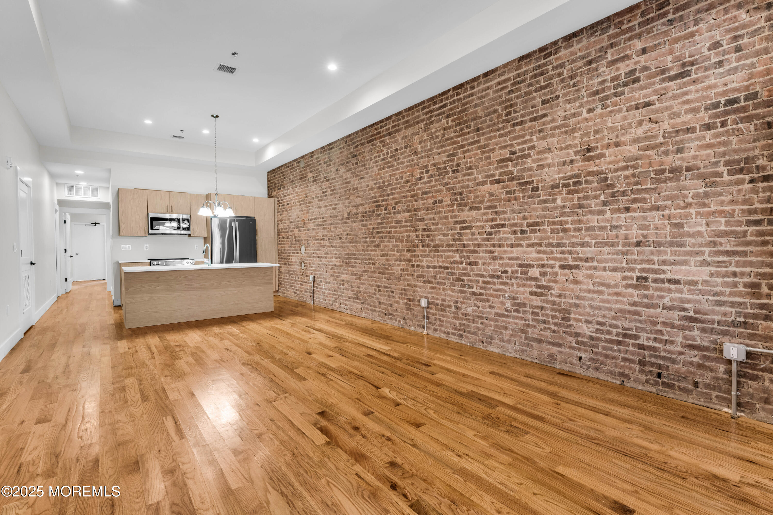 7 Broad Street, Unit 2 Red Bank, NJ 07701 - Photo 8 of 23 a living room with a wooden floor