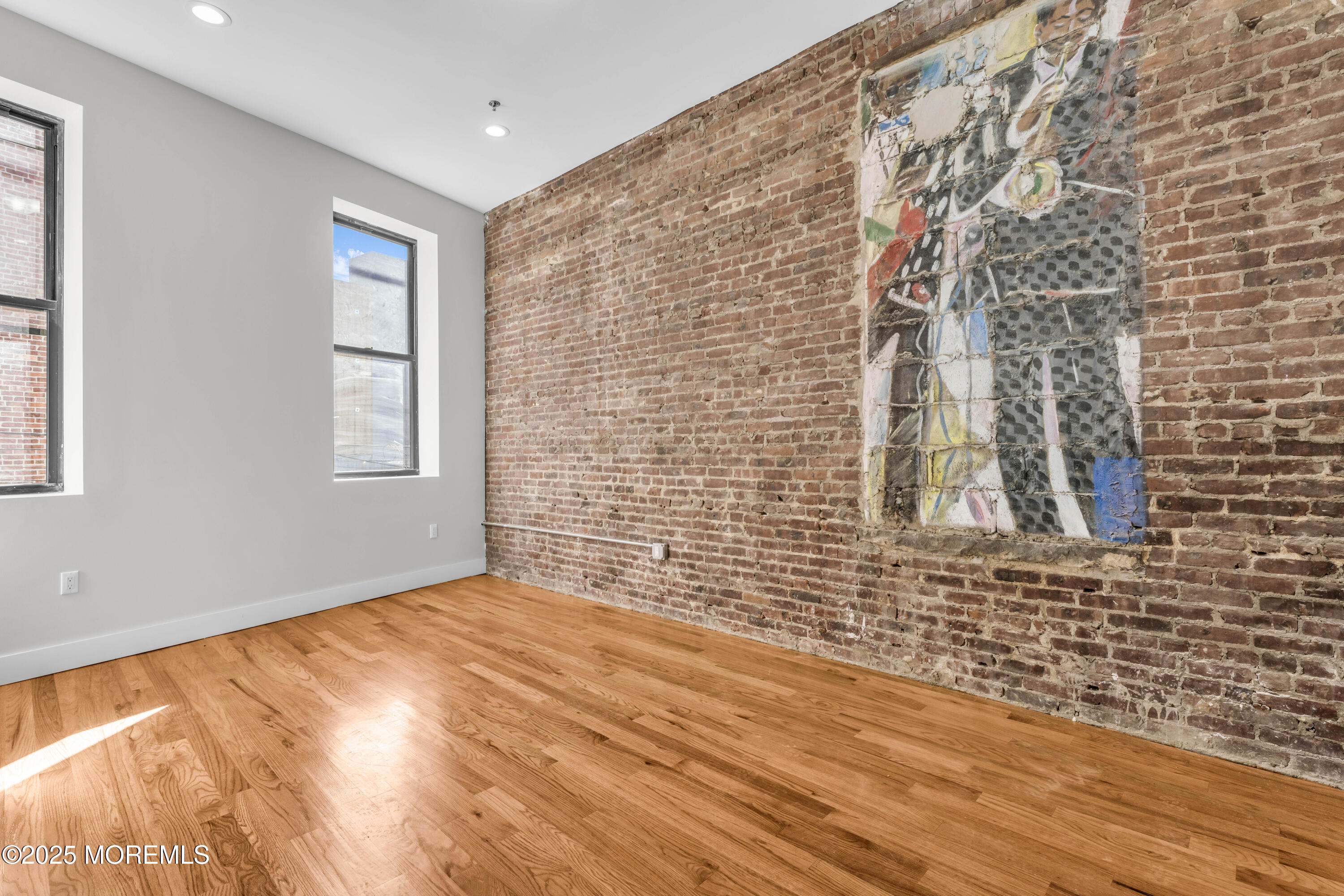 7 Broad Street, Unit 2 Red Bank, NJ 07701 - Photo 10 of 23 a view of empty room with windows
