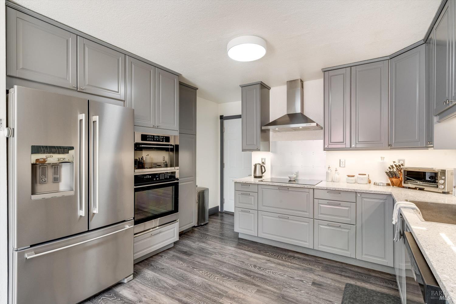 30 Fredrick Drive Rohnert Park, CA 94928 - Photo 2 of 41 Remodeled kitchen featuring modern cabinetry, quartz counters, and stainless appliances