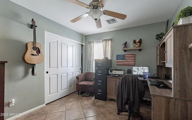a bedroom with furniture and a window