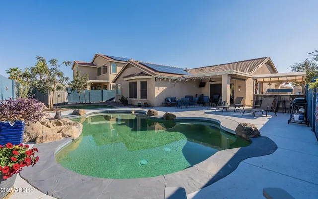 a view of a house with swimming pool