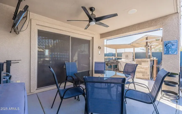 a dining room with furniture window and wooden floor