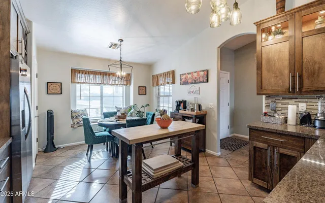a table and chairs in a kitchen
