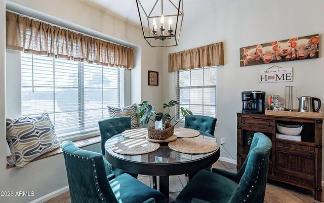 a view of a dining room with furniture window and outside view