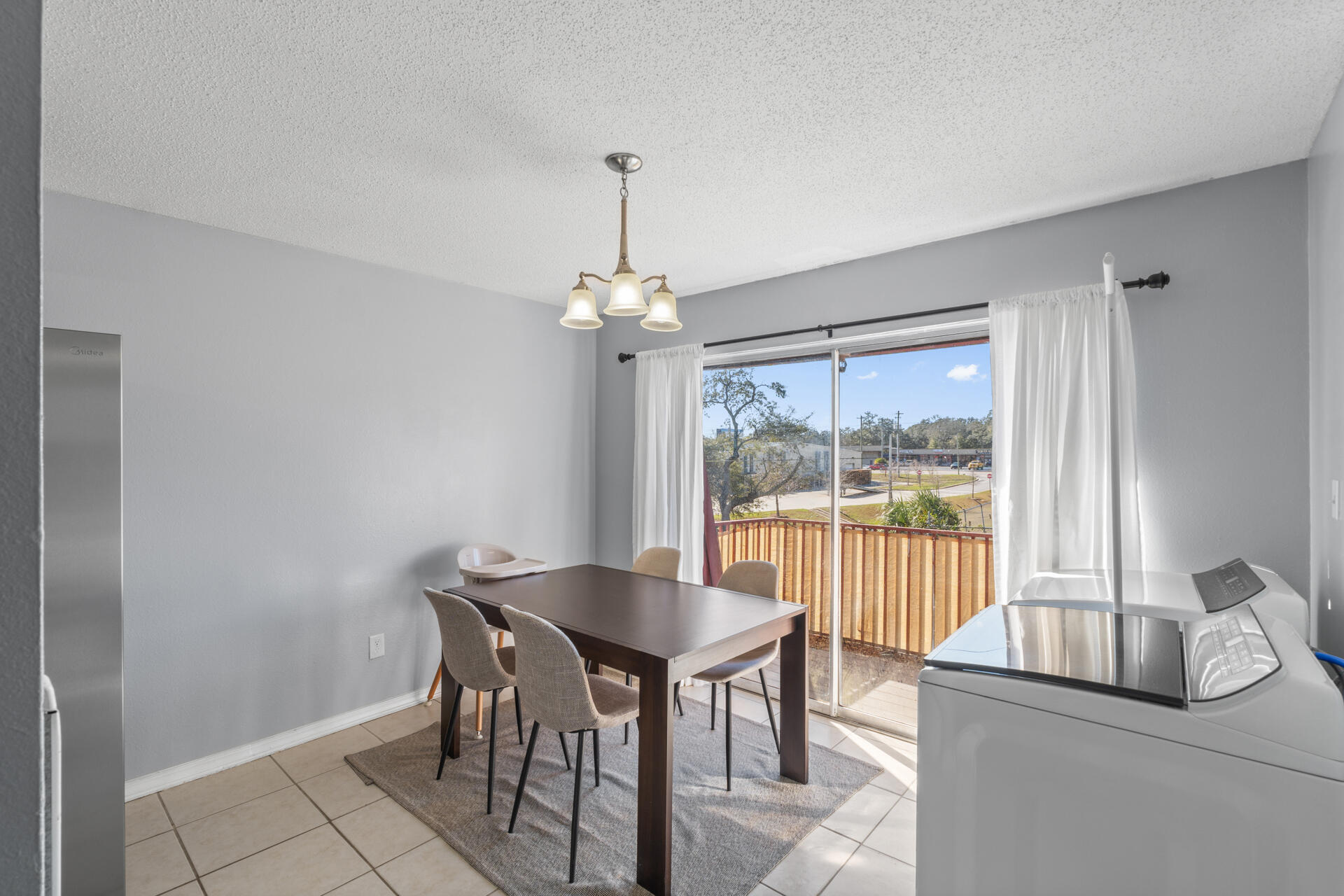 210 Pelham Road, Unit 220A Fort Walton Beach, FL 32547 - Photo 13 of 38 a dining room with furniture and window