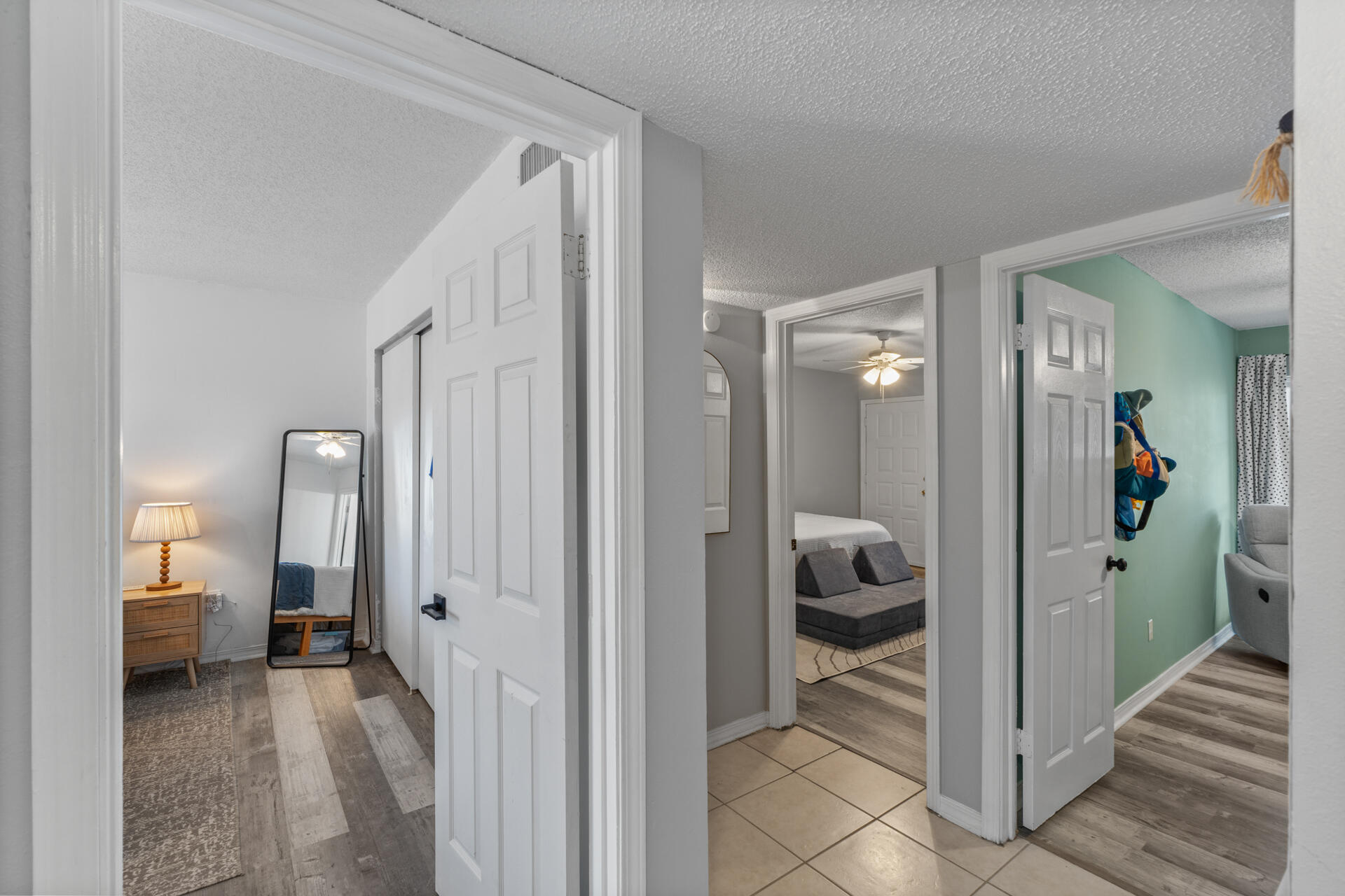 210 Pelham Road, Unit 220A Fort Walton Beach, FL 32547 - Photo 18 of 38 a view of a hallway with a livingroom and bedroom and bedroom