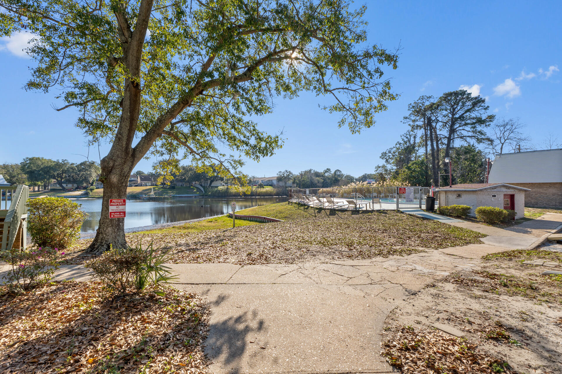 210 Pelham Road, Unit 220A Fort Walton Beach, FL 32547 - Photo 2 of 38 a view of a yard with a tree