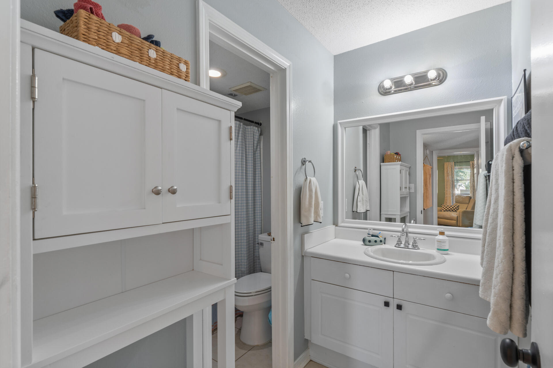 210 Pelham Road, Unit 220A Fort Walton Beach, FL 32547 - Photo 22 of 38 a bathroom with a sink a toilet and shower