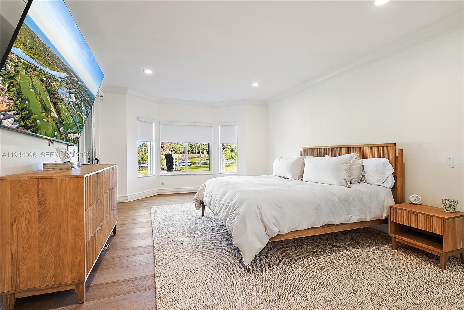 1602 Captains Way Jupiter, FL 33477 - Photo 11 of 35 a bed room with a bed and a large window