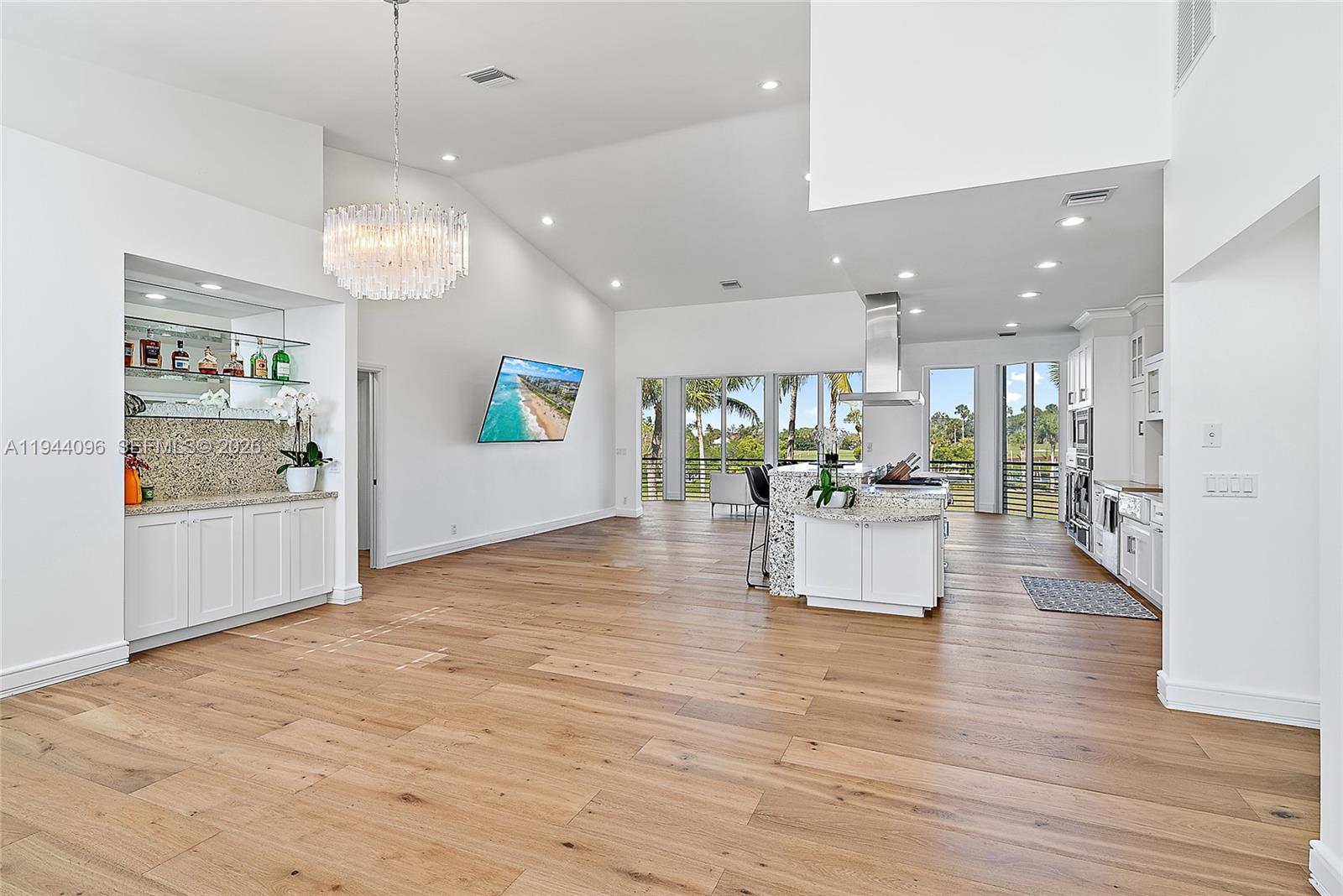 1602 Captains Way Jupiter, FL 33477 - Photo 5 of 35 a view of kitchen with furniture and wooden floor