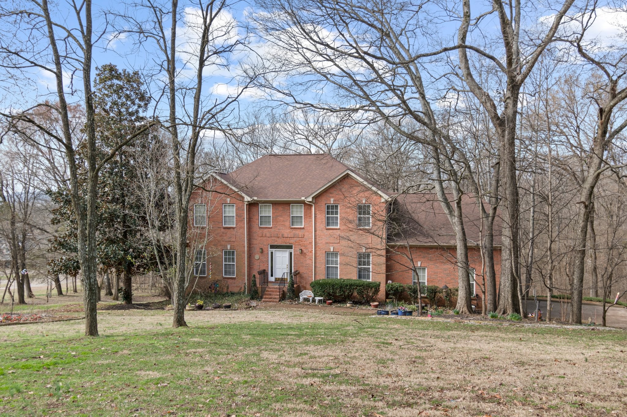 4259 Warren Road Franklin, TN 37067 - Photo 2 of 53 a front view of a building with a yard