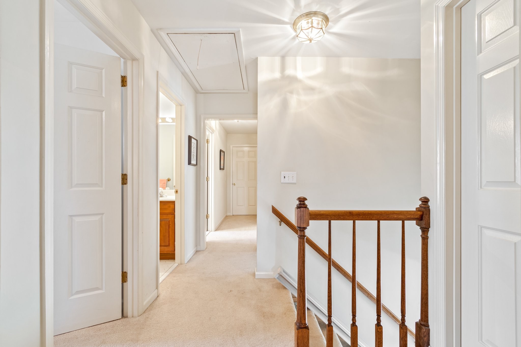 4259 Warren Road Franklin, TN 37067 - Photo 32 of 53 a view of a hallway with wooden floor and staircase