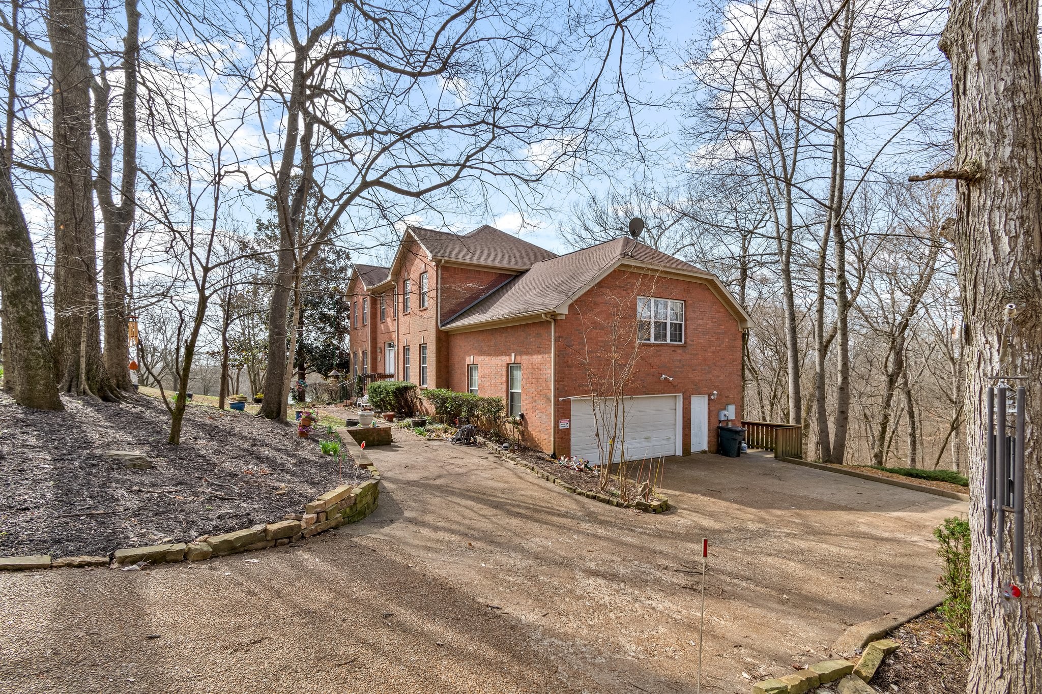 4259 Warren Road Franklin, TN 37067 - Photo 4 of 53 a front view of a house with a yard covered with snow