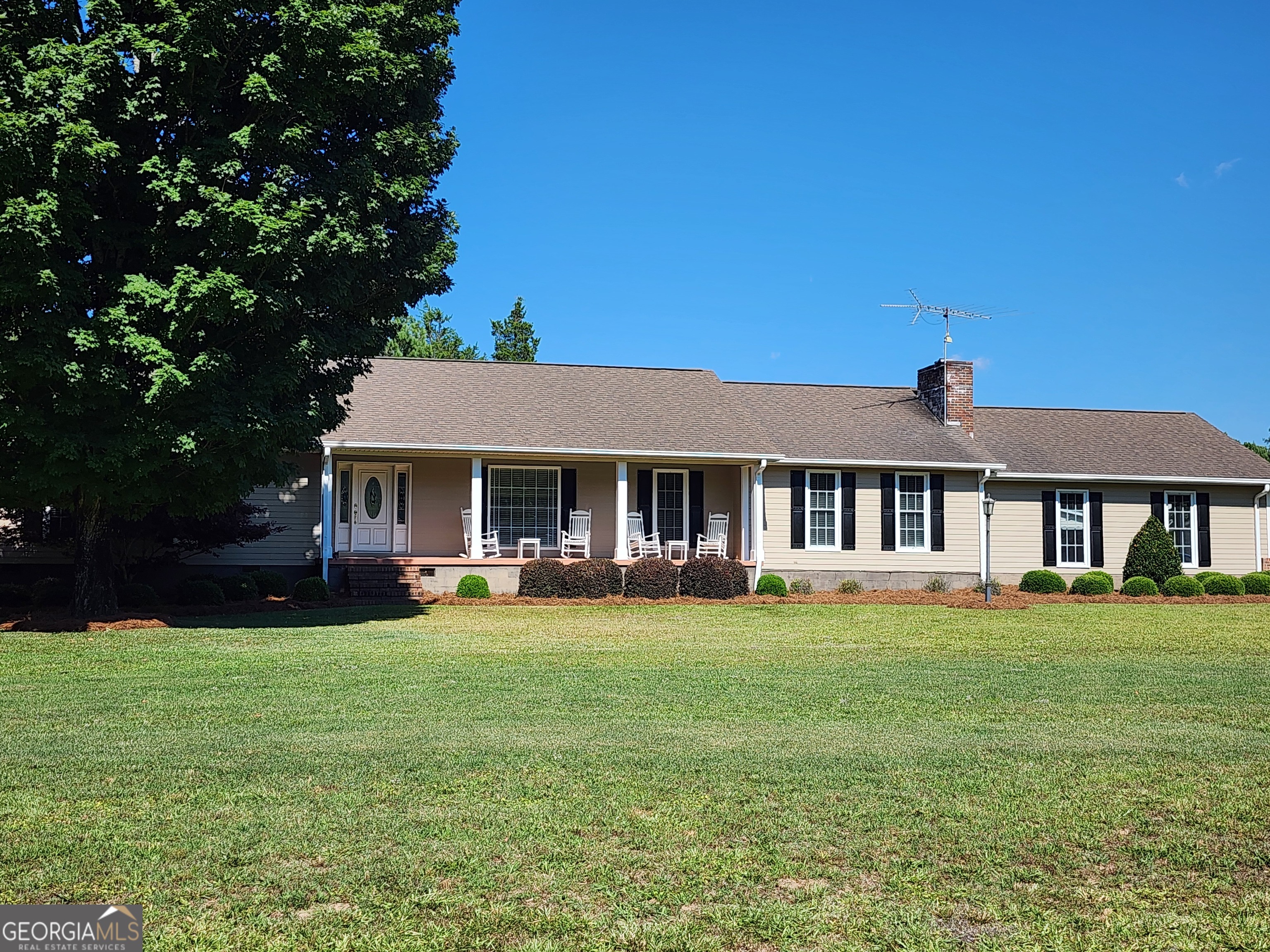 238 Five Points Road Milner, GA 30257 - Photo 1 of 1 a front view of a house with garden