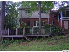 3922 Fellsway Road Charlotte, NC 28209 - Photo 15 of 16 a view of a house with wooden fence and a yard