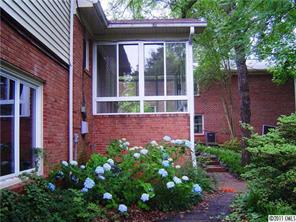 3922 Fellsway Road Charlotte, NC 28209 - Photo 16 of 16 a view of a backyard with potted plants and a fountain