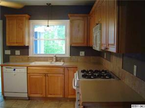 3922 Fellsway Road Charlotte, NC 28209 - Photo 5 of 16 a kitchen with a sink a stove and cabinets