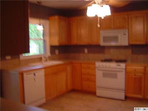 3922 Fellsway Road Charlotte, NC 28209 - Photo 6 of 16 a kitchen with a cabinets and window
