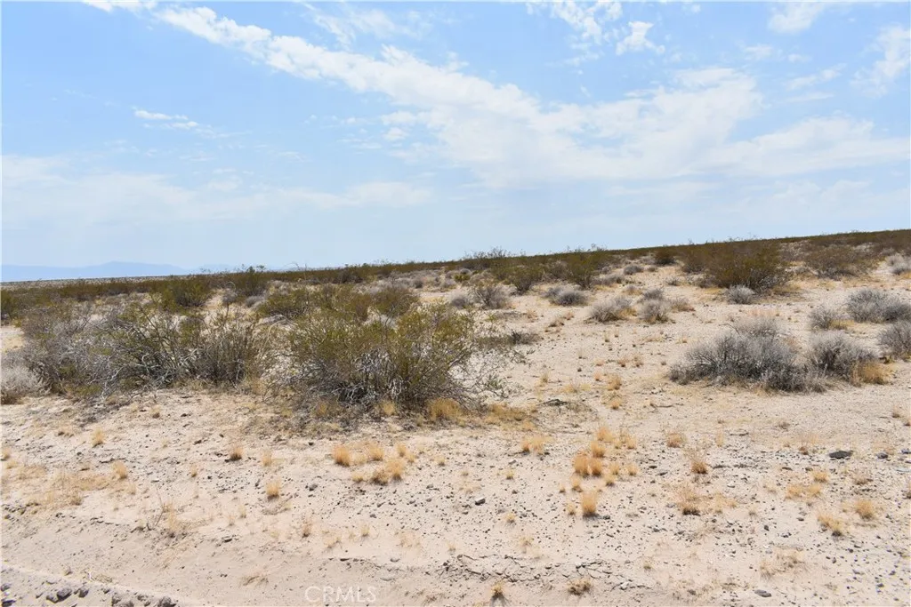 a view of ocean view with wooden floor and covered with snow in the background